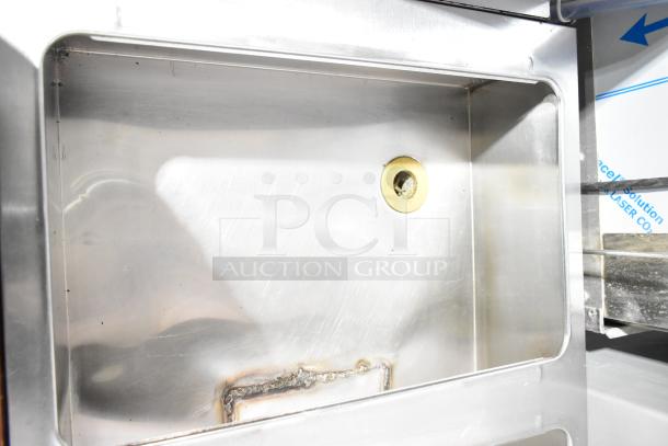 Commercial 3 well steam table featuring stainless steel construction, butcher block cutting board, and under shelf.