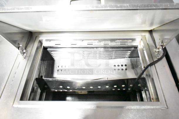 True Commercial Sandwich Salad Prep Table, Bain Marie Mega Top, stainless steel interior, open lid view, on casters.