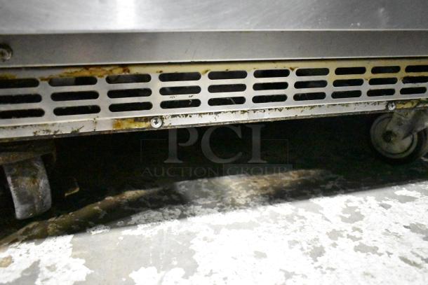 Everest ETBR1 commercial undercounter cooler with seen metal vent and casters. Condition shows signs of use. 115V, 1 phase.