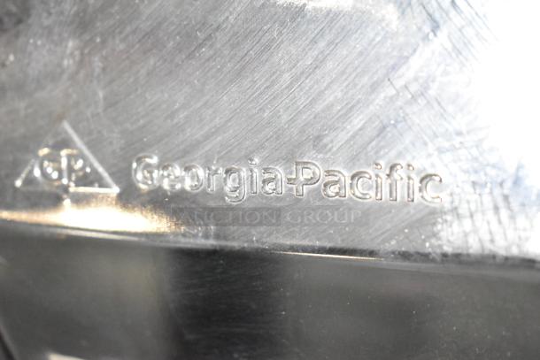 Georgia Pacific dispenser with embossed branding, metal finish, in good condition. Features GP logo and Georgia-Pacific text.