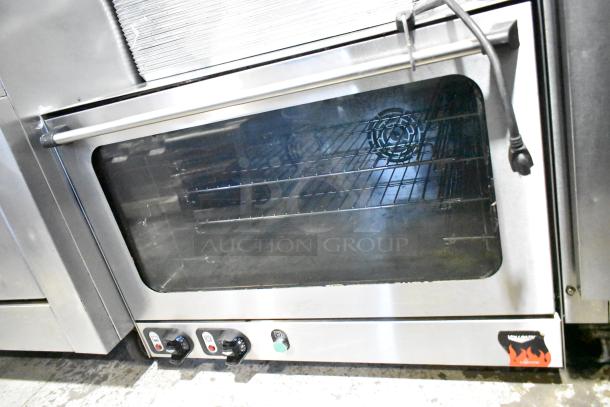 Vollrath Cayenne countertop convection oven, 115 volts, 1 phase. Features glass door, multiple racks, control knobs, good condition.