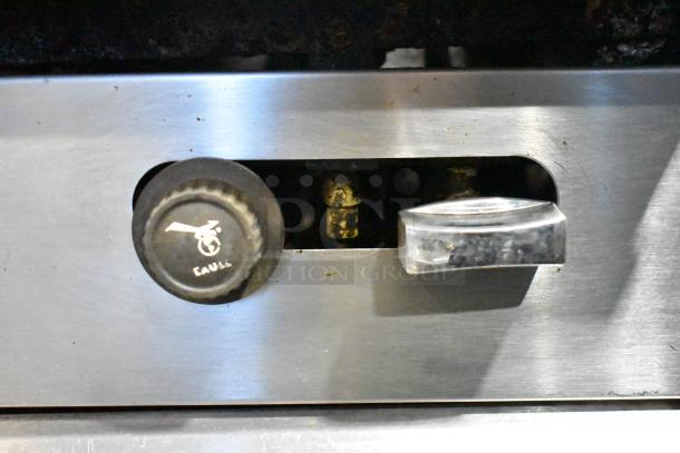 Garland SunFire gas range control knobs, featuring durable materials, on the commercial 6 burner range.
