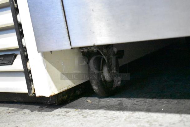 Garland SunFire 6 Burner Gas Range with oven, over shelf, backsplash, and commercial casters; durable and versatile for kitchens.