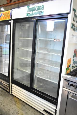 True GDM-45 commercial 2-door reach-in cooler merchandiser, features Tropicana branding. 115 volts, good condition.