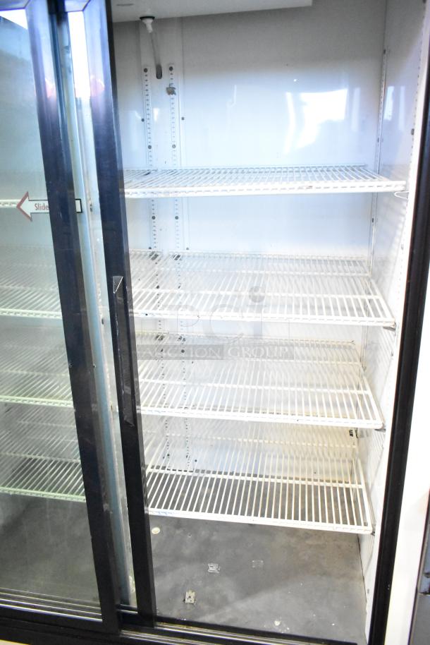 True GDM-45 2-Door Reach In Cooler Merchandiser, 115V, 1 Phase. Clean shelves, black trim, good condition.