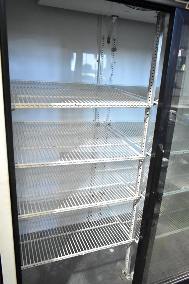 True GDM-45 commercial 2-door cooler merchandiser, 115 volts, 1 phase, features adjustable wire shelves in good condition.