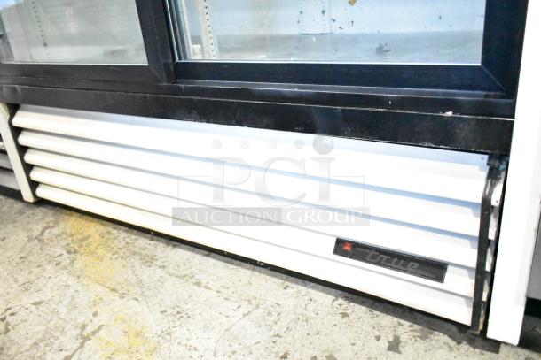 True GDM-45 2 Door Reach In Cooler Merchandiser, 115 Volts, 1 Phase, shows branding and exterior condition.