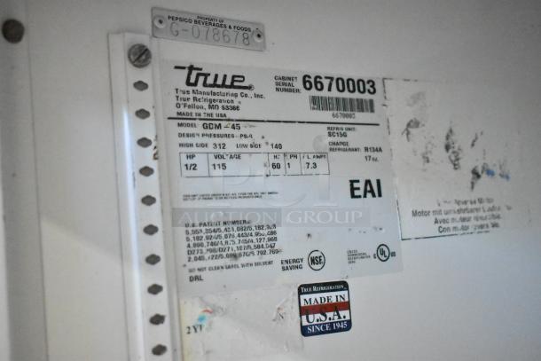 True GDM-45 cooler label showing model, voltage, phase, and refrigerant type. NSF certified, Made in USA. Serial: 6670003.