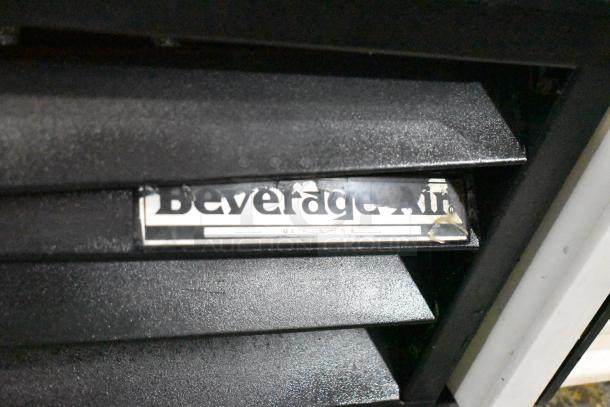 Beverage Air MT38 commercial cooler, 2 doors, 115 volts, brand label visible, black exterior, minor wear.