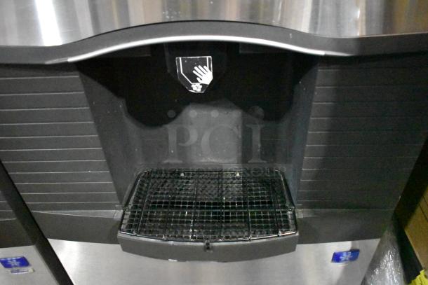 Manitowoc SD0452A ice machine head on SPA310 dispenser, 115 volts, 1 phase. Stainless steel, commercial use.