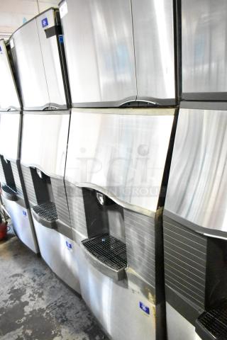 Manitowoc SD0452A Ice Machine on SPA310 Dispenser, 115V, 1 Phase. Silver exterior, commercial use.