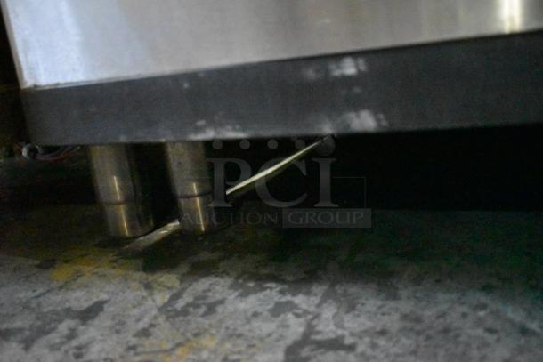 Manitowoc SD0452A ice machine head on SPA310 hotel ice dispenser, stainless steel legs, 115 volts, 1 phase.