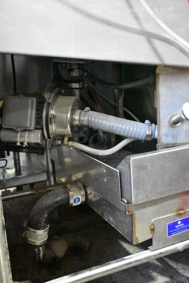 Ecolab ES-2000 commercial dishwasher base showing hoses and metal components, in used condition. NSF label visible.