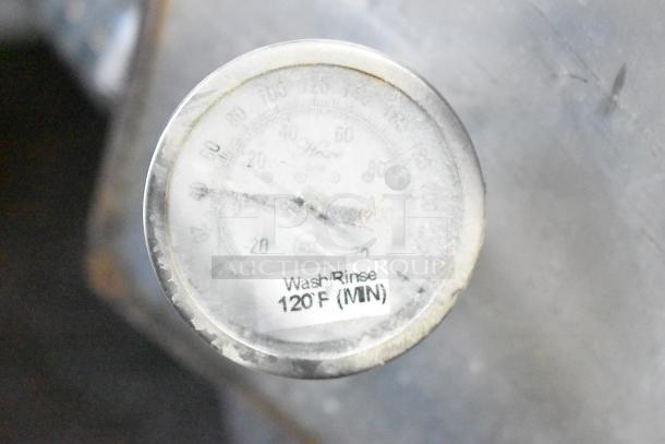 Thermometer on Ecolab ES-2000 dishwasher indicating wash/rinse temperature of 120°F (MIN).