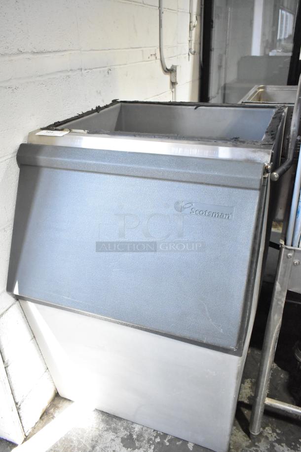 Scotsman Commercial Ice Bin, sturdy metal build, visible logo, used condition, ideal for large ice storage needs.
