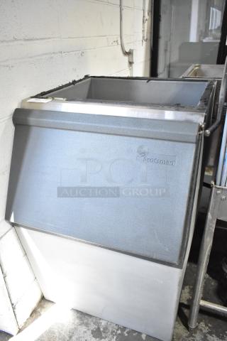 Scotsman Commercial Ice Bin, sturdy metal build, visible logo, used condition, ideal for large ice storage needs.