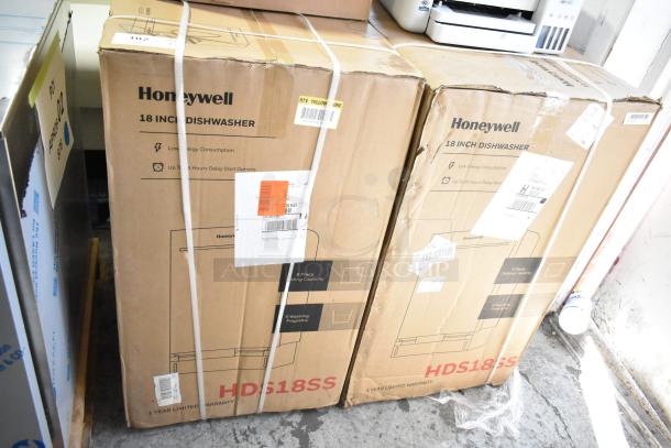 Two new Honeywell HDS18SS dishwashers in original boxes, featuring 8 place settings, 6 washing programs, and stainless steel tub. Boxes display model and energy-efficient labels.
