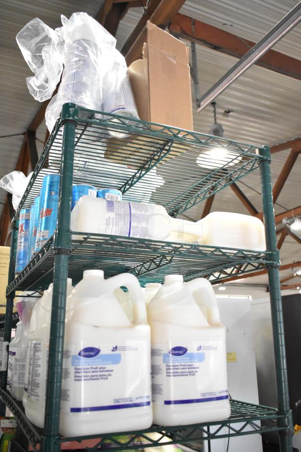 Three-tier shelf with Ajax Heavy Duty Cleaner, Diversey Oxivir Sanitizer. Various bottles and packaging visible.