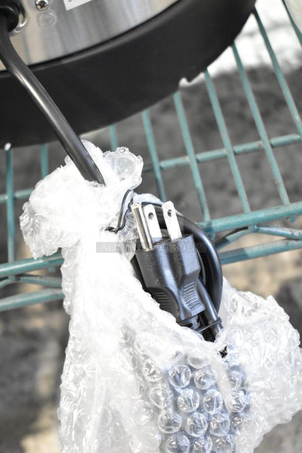 Alt text: Avantco 177WB29L water boiler plug wrapped in bubble wrap, shown with a power cord. 7.6 gallon capacity, 120 volts.