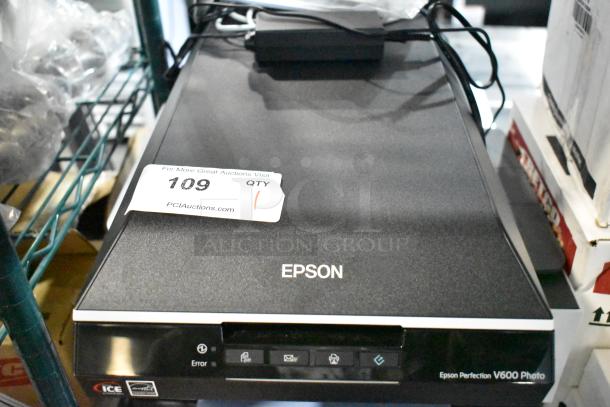 Epson Perfection V600 Photo Scanner, flatbed, excellent condition. Model details visible, includes original packaging.