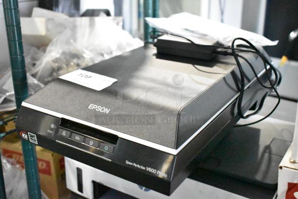 Epson Perfection V600 Photo Flatbed Scanner, black, with ICE Technology label, power cord attached, good condition.