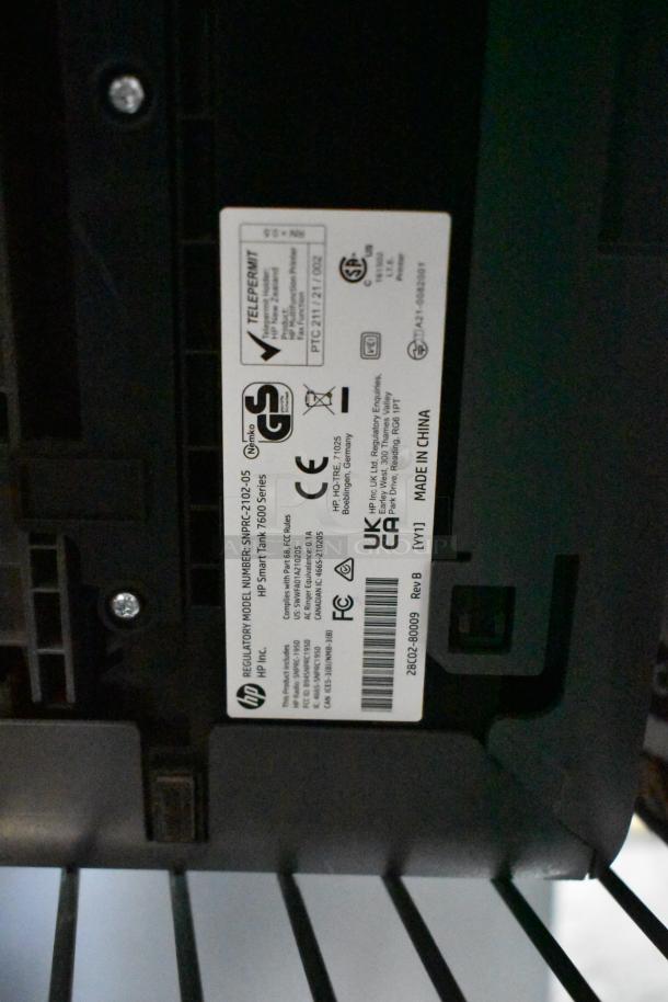 HP Smart Tank 7602 printer label shows model details, voltage, and certifications.