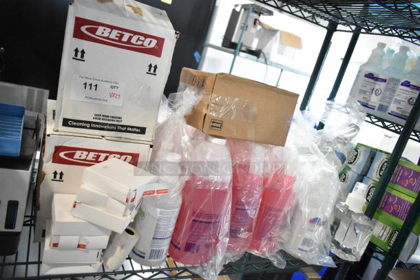 Boxes of Betco Cleaner and bottles of Provon Foam Handwash on shelves. Includes Breakdown Odor Eliminator. 27 items total.