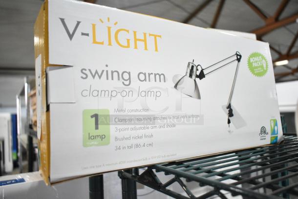 IN ORIGINAL BOX! V-light Swing Arm Clamp On Lamp, metal construction, 3-point adjustable arm, brushed nickel finish.