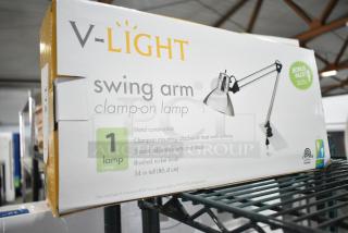IN ORIGINAL BOX! V-light Swing Arm Clamp On Lamp, metal construction, 3-point adjustable arm, brushed nickel finish.