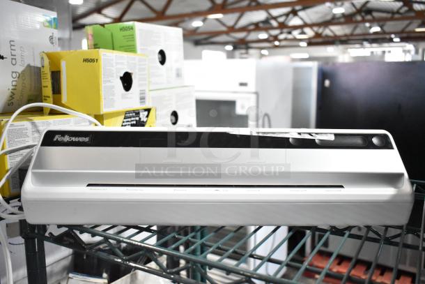 Fellowes CRC 57366 Laminator Machine, 120 Volts, 1 Phase, in good condition on shelf.