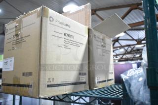 Two boxes of PremierPro 676111 Disposable Underpads, 30x36 inch, new in box, marked heavy absorbency, 5 bags per box.