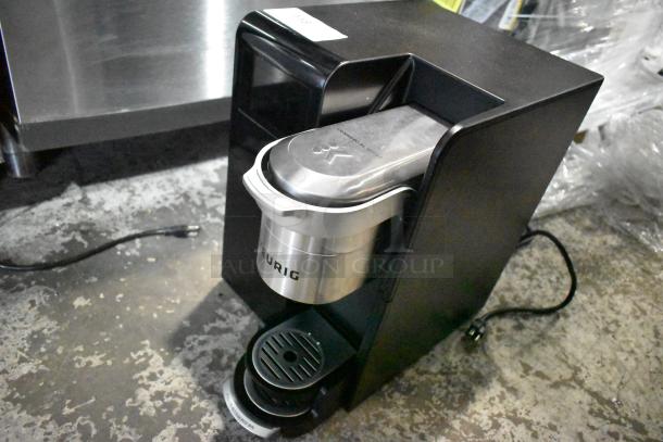 Keurig single cup coffee machine, countertop model, 120V, 1 phase, black, stainless steel brew head, used condition.