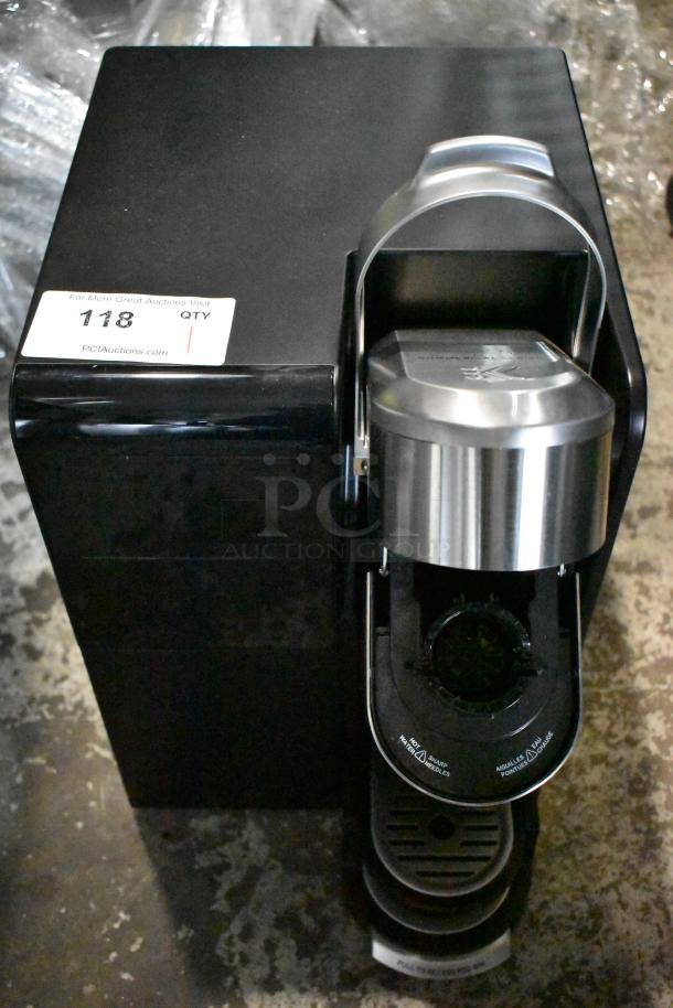Keurig single cup coffee machine, black and stainless steel, 120 volts, 1 phase, countertop model. Auction label "118".