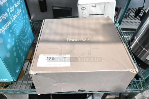 Brown FrancoSarto boot box labeled "scratch and dent," size 9.5, minor damage on corners, auction tag visible.