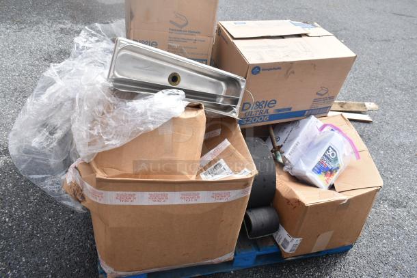 15 brand new scratch and dent items, including Dixie Ultra 32006 napkins and outdoor cleaner, on a pallet.