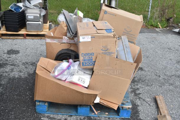 15 new scratch and dent items including Dixie Ultra 32006, cleaner, Purell soap, and more on pallet for auction.