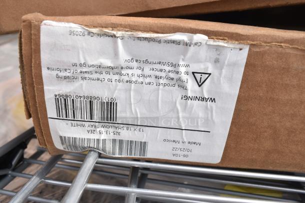 Cardboard box with a label showing a barcode and warning text. The box is part of a lot including Metro SW40K3 SmartWall Wall Track, Duraloc 24" Tool Holder, and WST1806Y Storage Cart.