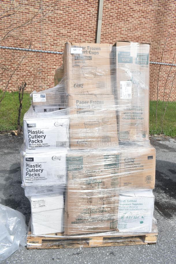 Pallet of 30 new scratch and dent items including napkins, towels, cutlery, and cups, wrapped in plastic.