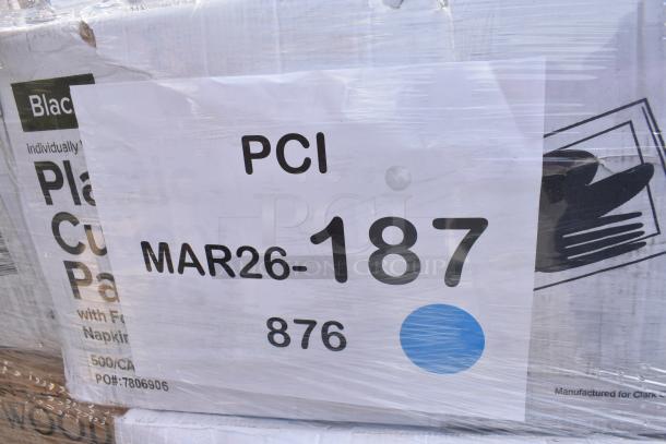 Plastic-wrapped pallet marked "PCI, MAR26-187, 876" containing new scratch and dent items like napkins and cups.