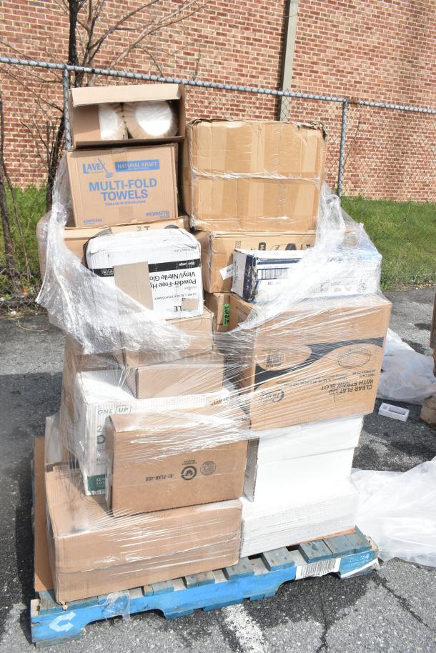Shrink-wrapped pallet of 22 mixed boxed items, including Lavex Multi-Fold Towels, trash bags, and cling film, marked as scratch and dent.