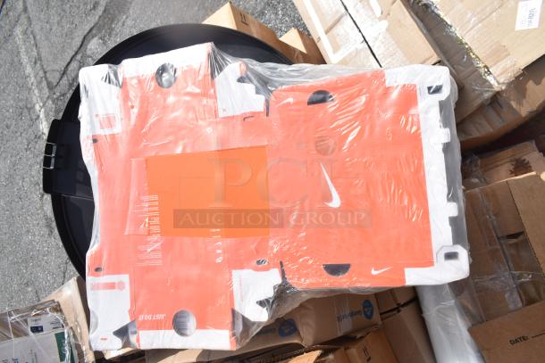 Pallet of boxed items wrapped in plastic, including Nike packaging. Condition is scratch and dent. Various items included.
