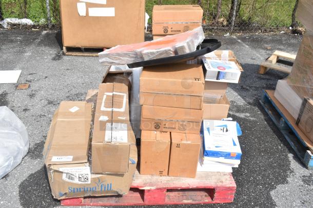 Boxes of new scratch and dent items on a red pallet, including Health Guards KL260 and Sani-Cloth Large Wipes.