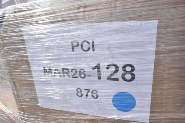 Pallet wrapped in plastic showing label "PCI MAR26-128 876" with a blue dot. Contains assorted new items like scraper and wastebasket.