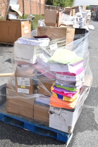 Pallet of assorted scratch and dent items, including various colored paper reams, boxed filing cabinet, and Zebra label printers.