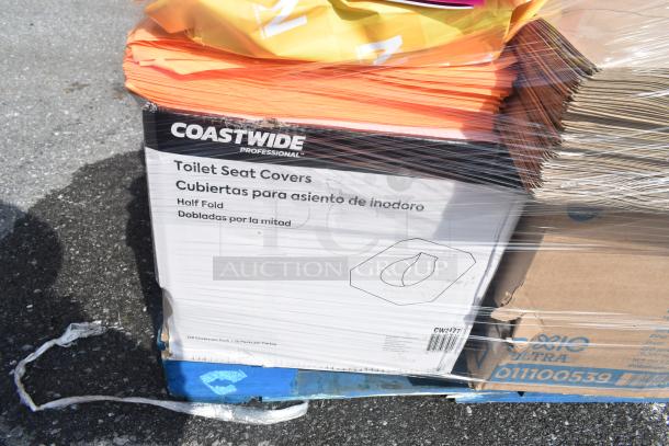 20 scratch and dent items including Coastwide toilet seat covers, paper reams, carton boxes, wrapped, on pallet.