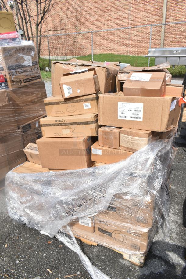 Pallet of brand new scratch and dent items including kitchenware and hardware, wrapped in plastic, boxes labeled with item types.