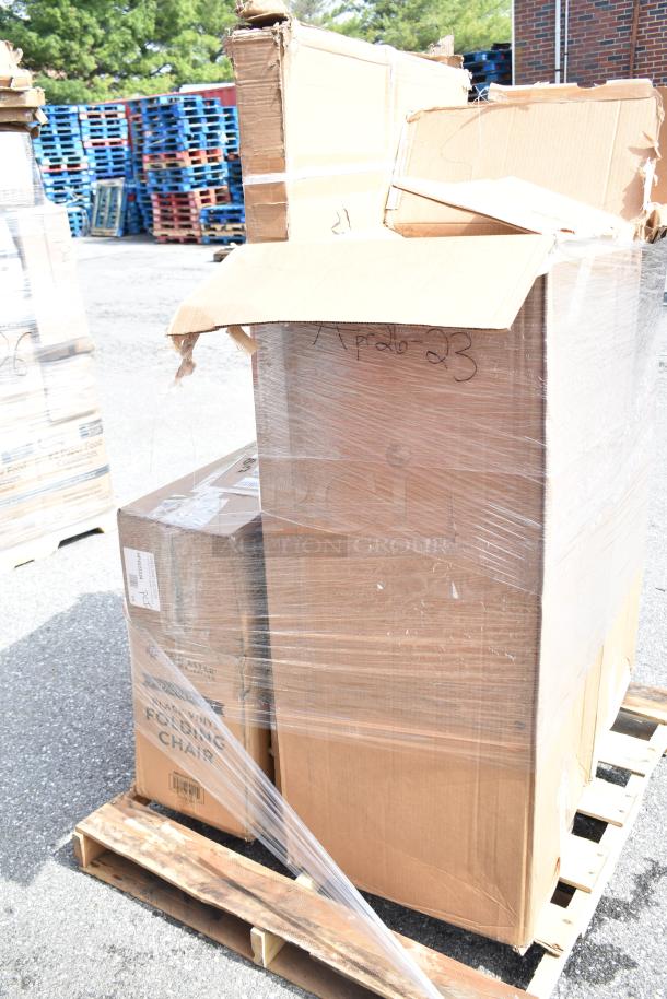 Boxes of scratch and dent items, including chairs, wrapped on a pallet. Marked "APR26-23." Boxes show wear.