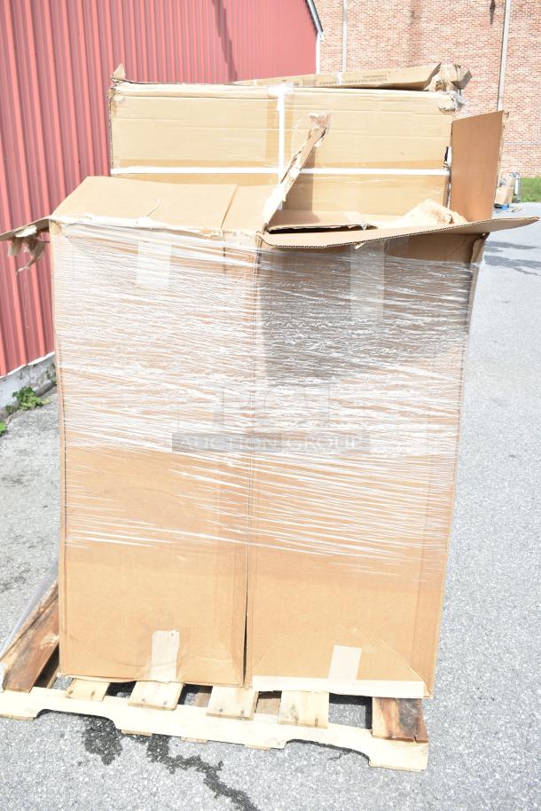 Sealed pallet with large, taped cardboard boxes showing minor damage. Contains 5 new scratch-and-dent items, including chairs.