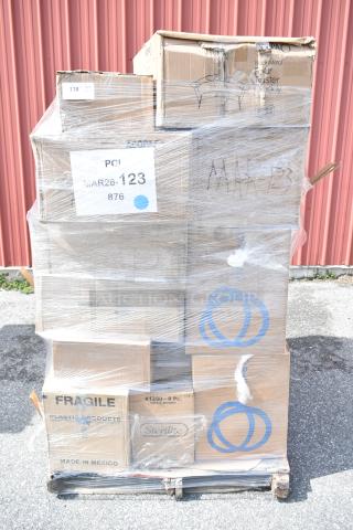 Pallet of 34 brand new scratch and dent items wrapped in plastic, including dessert dishes and trays. Labeled "MAR26-123."