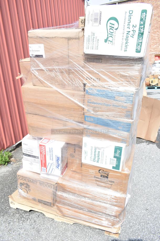 25 brand new scratch and dent items including wood logs, containers, cold cups, napkins on a pallet, shrink-wrapped.